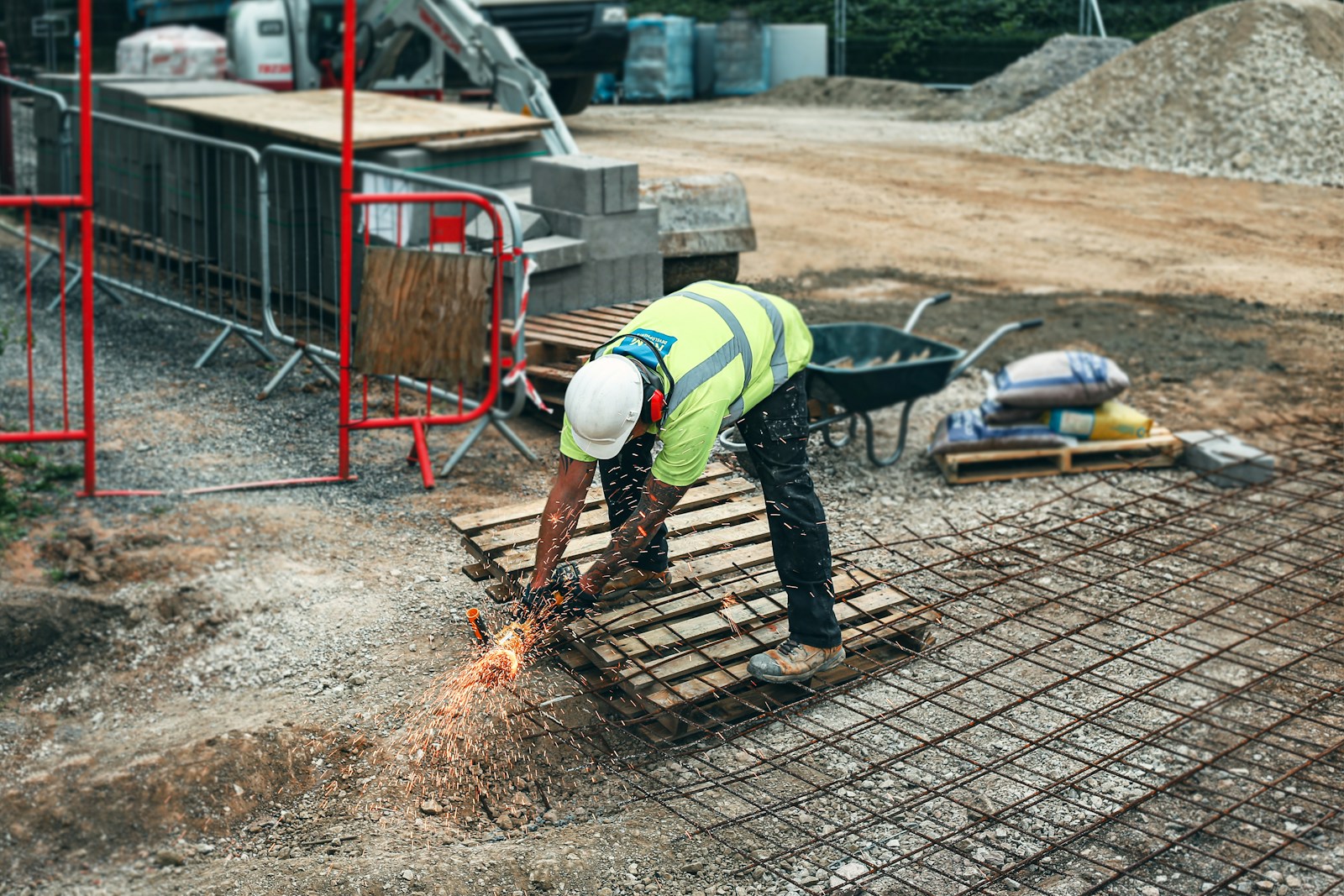 Tradesman at a job site cutting steel